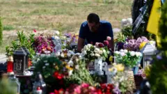 Чоловік на цвинтарі