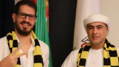 Al Nahyan (right) poses with a Beitar Jerusalem shirt alongside club owner Moshe Hogeg