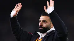Mohamed Salah waves to fans