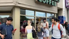 People using internet at a Starbucks
