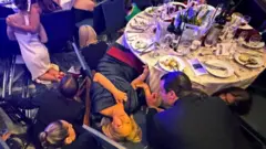 Guests shelter after shots heard at dinner event