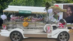 Carriage conveying Ifeany Ubah casket
