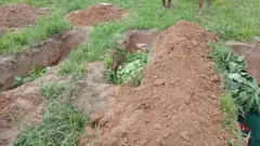 Graves of some of di pipo wey die for di attack