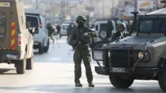 Security measures increased after a Palestinian gunman shot dead two Israelis in the occupied West Bank