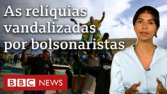Pessoas vestidas em verde e amarelo sobem em estátua do STF