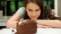 a women eyeing a cake