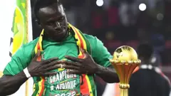 Sadio Mane and the Nations Cup trophy