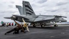 An F/A-18E Super Hornet, attached to Strike Fighter Squadron 151, launches from the flight deck of the USS Abraham Lincoln (CVN 72) while conducting routine flight operations in the Arabian Sea. 