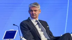UK National Security Adviser Sir Stephen Lovegrove seen on a stage at a conference