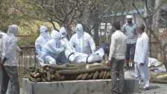 A Covid patient being cremated in Ghaziabad in Uttar Pradesh