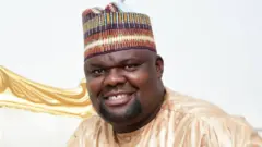 Sanusi Oscar tare da abokan harkarsa