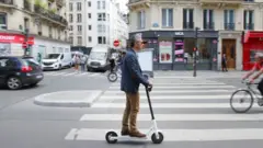 A man rides an electric scooter in Paris on 17 June 2019