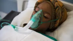 Une malade sous oxygène