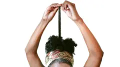 Woman wey dey observe her long gray hair