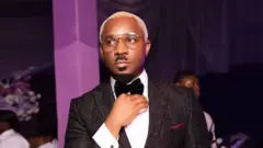 Lagos socialite Pretty Mike wear black suit, white shirt and one black bow tie