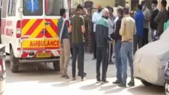 তিন বছর ঘর বন্দী থাকার পরে এক নারী ও তার পুত্রকে উদ্ধার করে নিয়ে যাওয়া হচ্ছে