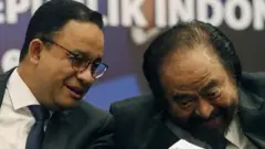 Anies Baswedan (kiri) dan Surya Paloh.