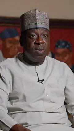 ADC tok tok pesin looking at di camera