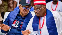 Peter Obi and Kwankwaso talking together during di NDC convention