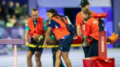 ለሜቻ በቃሬዛ ከሜዳ ሲወጣ