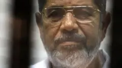 Morsi behind bars