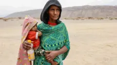 Azier Muhammed-Muhammed of Konnaba recounts losing her sister when the TPLF shelled the town of Konnaba during their attacks in January of 2022 at the Silsa Internally Displaced Peoples' (IDP) camp on March 24, 2022 in Silsa, Ethiopia.
