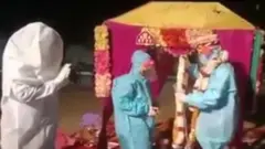 కరోనా రక్షణ దస్తుల్లో వివాహం