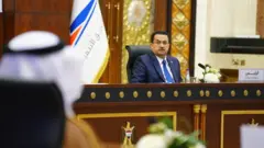رئيس الوزراء العراقي محمد شياع السوداني خلال مؤتمر "طريق التنمية" في بغداد