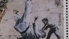 A newly-issued Ukrainian postage stamp featuring a work by UK graffiti artist Banksy. Photo: 25 February 2023