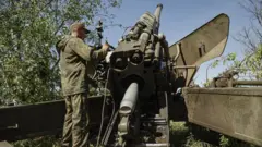 Self-proclaimed Donetsk People"s Republic (DPR) militia prepare to fire in Avdiivka (file pic)