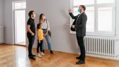 family looking in house