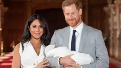 MAY 08: Prince Harry, Duke of Sussex and Meghan, Duchess of Sussex, pose with dia newborn son Archie Harrison Mountbatten