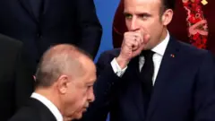President Recep Tayyip Erdogan (L) and President Emmanuel Macron in 2019