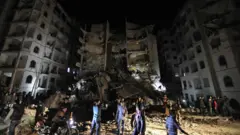 A picture shows the site of an explosion of unknown origin which killed 11 civilians in Syria"s northwestern jihadist-held city of Idlib on April 9, 2018.