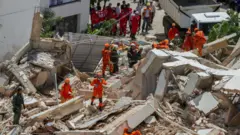 Bombeiros procuram sobreviventes no edifício Andrea