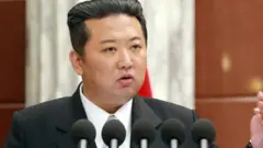 North Korean leader Kim Jong Un attends a plenary meeting in image released on 28 December