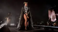 Beyoncé performs in an outfit inspired by Queen Nefertiti at the Coachella festival in California (14 April 2018)
