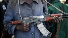 Man holds gun