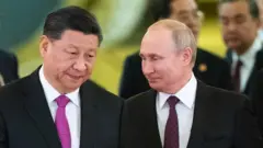 Russian President Vladimir Putin and his Chinese counterpart Xi Jinping enter a hall for the talks at the Kremlin in Moscow on June 5, 2019.