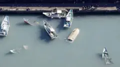 Capsized boats in Muroto, Kochi prefecture, Japan. Photo: 16 January 2022
