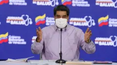 A handout photo made available by Miraflores press shows Venezuelan President Nicolas Maduro addressing members of his government cabinet, in Caracas, Venezuela