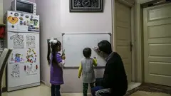 father with his children at home