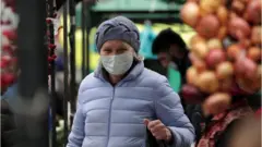 базардагы аял