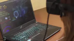 BBC presenter in front of a PC