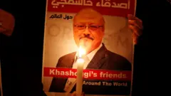 A demonstrator holds a poster with a picture of Jamal Khashoggi outside the Saudi consulate in Istanbul, Turkey October 25, 2018