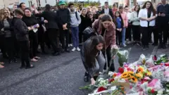 Members of the public leave flowers outside Windsor Castle