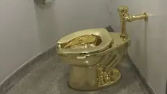 Gold toilet by Maurizio Cattelan