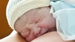 A baby breast feeding