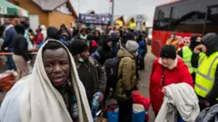 African nationals, mostly students of Ukrainian universities, at the Medyka pedestrian border crossing.