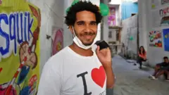 Luis Manuel Otero Alcantara, leader of the San Isidro Movement (MSI), poses for a picture minutes at his home in Havana on 5 April